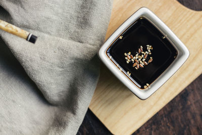 Soy sauce with sesame on a vessel