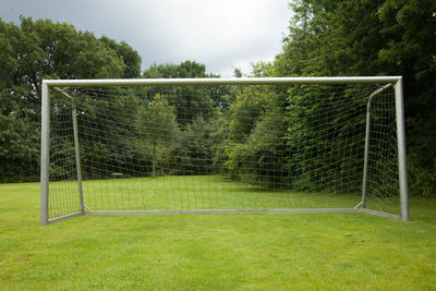 View of soccer field against trees