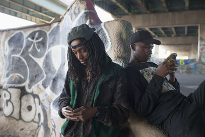 Two young men at a skateboard park.