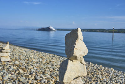 Rocks on beach against sky