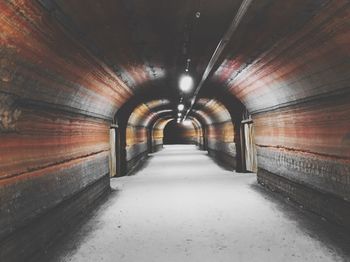 Empty corridor in tunnel