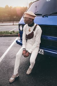 Full length of man standing on vehicle