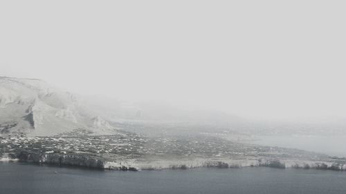 Scenic view of sea against sky during winter