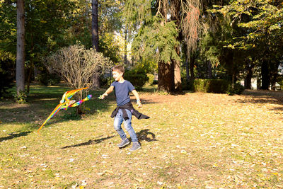 Full length of children playing on field