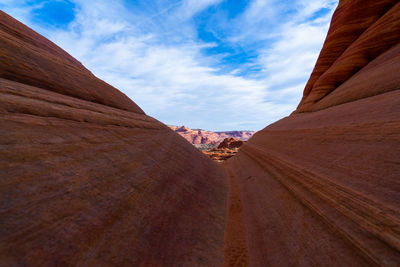Scenic view of mountain against cloudy sky