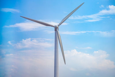 Low angle view of wind turbine against sky