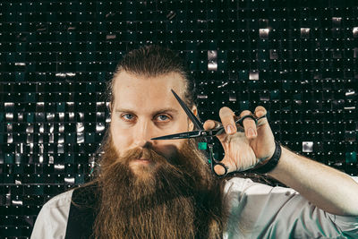 Thoughtful young man smoking cigarette