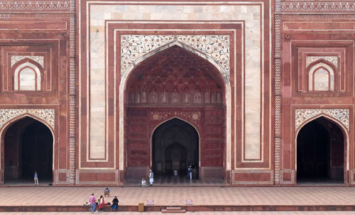 Gate to the taj mahal, crown of palaces, an ivory-white marble mausoleum in agra, india