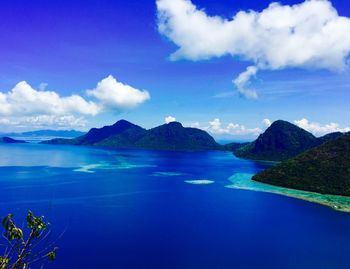 Scenic view of mountains against cloudy sky