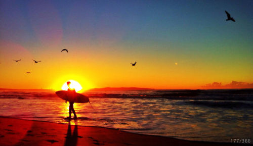 Scenic view of sea at sunset