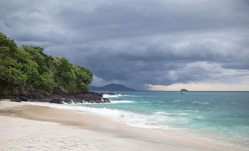 White sand beach on the sunrise with white indian ocean. nobody in the beach. paradise