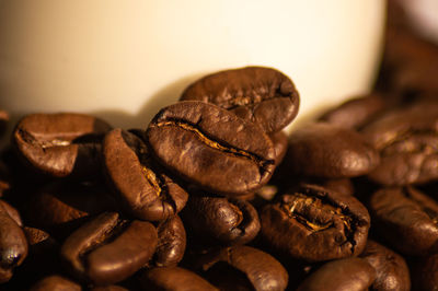 Close-up of coffee beans on table