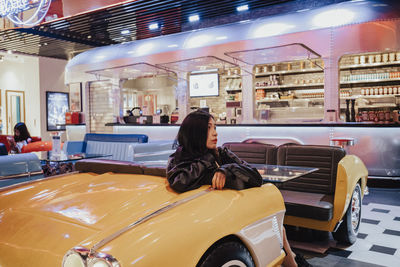 Car styling restaurant, asian girl