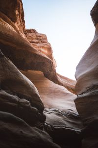 Low angle view of rock formations against sky