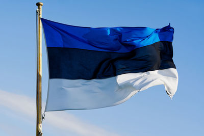 Low angle view of flag against sky