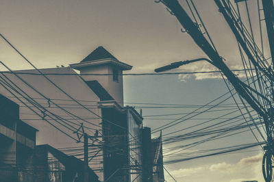 Low angle view of bridge against sky in city