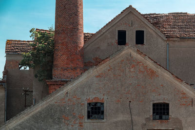 Low angle view of old building against sky