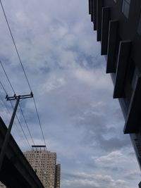 Low angle view of buildings in city against sky