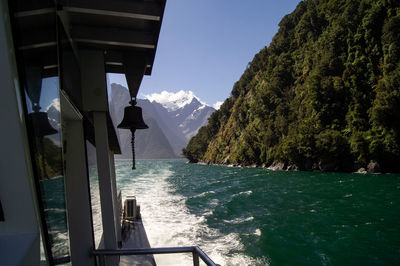 Panoramic view of sea and mountains against clear sky