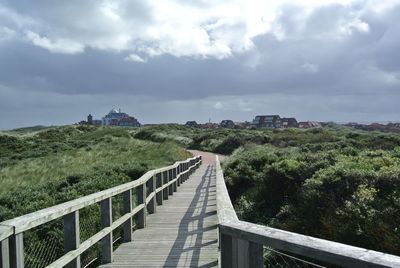 View of buildings against cloudy sky