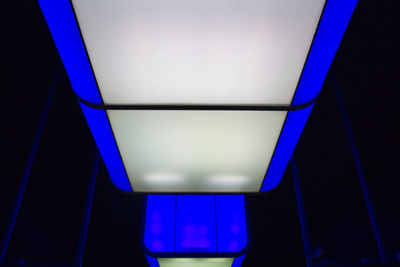 Low angle view of illuminated lights on ceiling