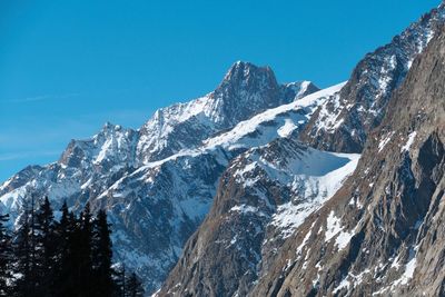 Scenic view of snowcapped mountains against clear sky