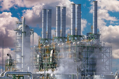 Oil industry refinery factory , petroleum, petrochemical plant with cloudy sky.