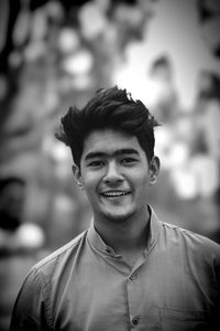 Portrait of a smiling young man outdoors