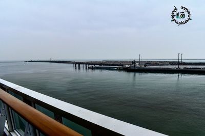 Pier over sea against sky