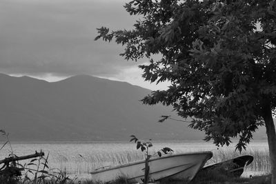 Scenic view of sea and mountains against sky