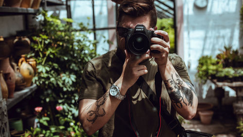 Portrait of woman photographing