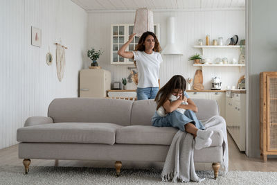 Young woman using digital tablet at home