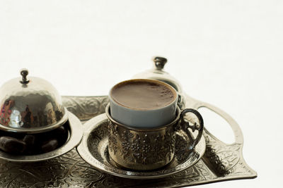 Close-up of coffee cup on table