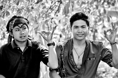 Portrait of young couple standing outdoors