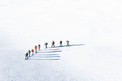 People skiing on beach