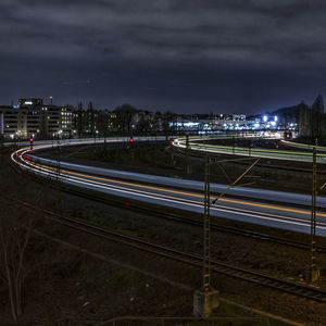 High angle view of light trails on road in city