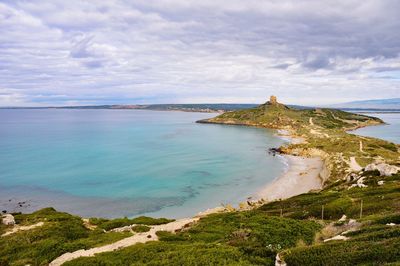 Scenic view of sea against cloudy sky