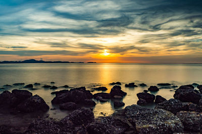 Scenic view of sea against sky during sunset