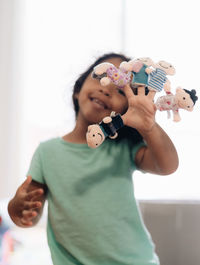 Boy playing with toy at home