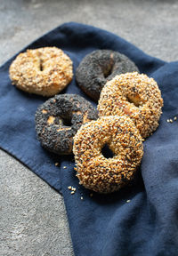 Freshly baked sesame and poppy seeded bagels. close up.