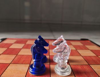 Close-up of chess pieces on table