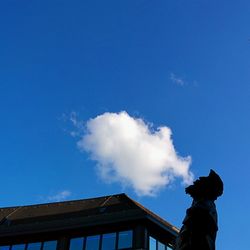 Low angle view of built structure against blue sky