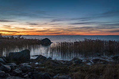 Scenic view of sea against sky during sunset