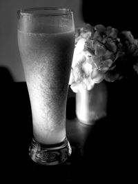 Close-up of white roses in vase on table