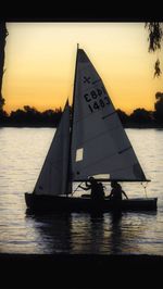 Boat in sea at sunset