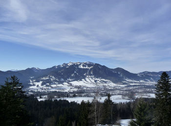 Scenic view of snowcapped mountains against sky