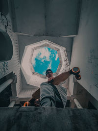 High angle view of woman standing against wall