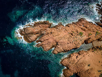 High angle view of rocks and sea