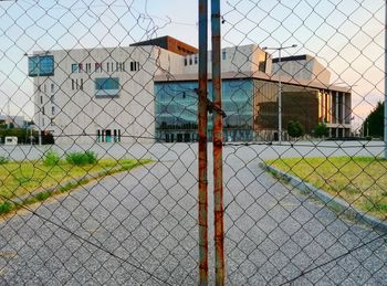 Close-up of chainlink fence against sky