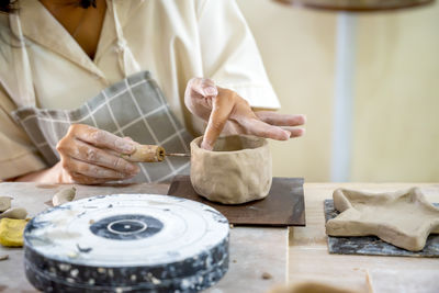 Midsection of woman preparing food